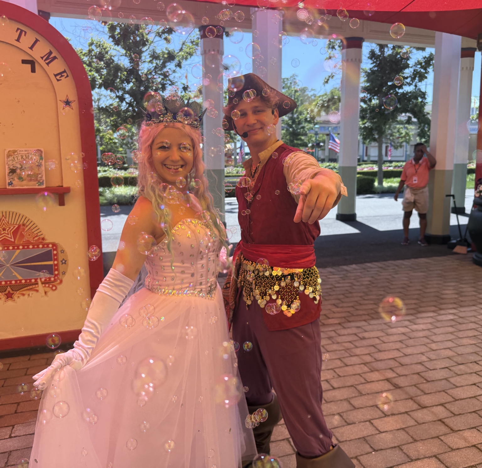 A princess and pirate greeting visitors at an outdoor park